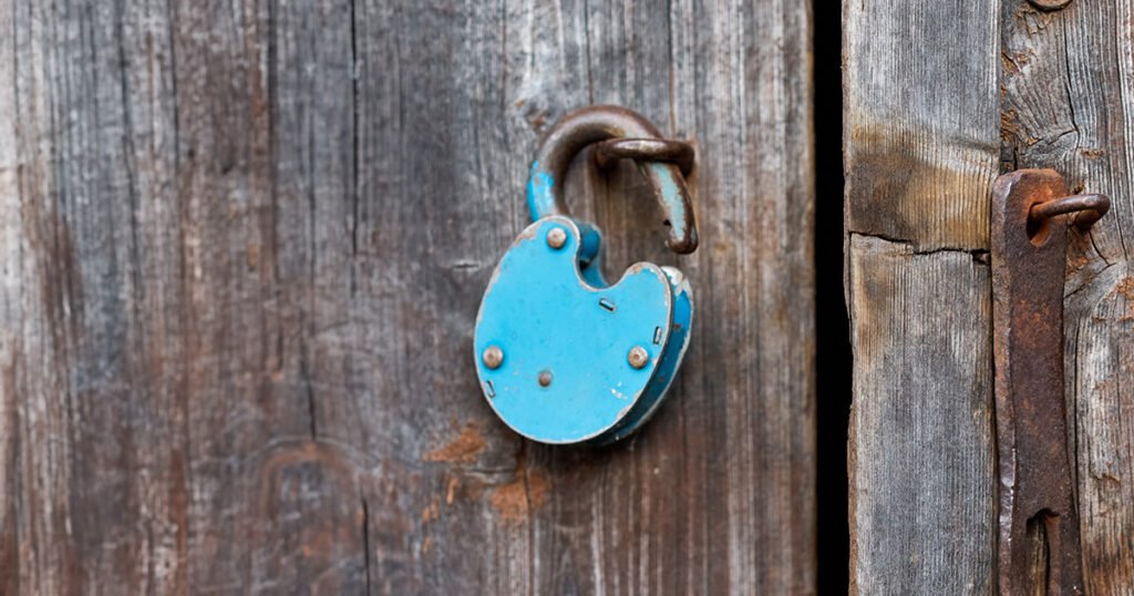 a blue lock on a wood door